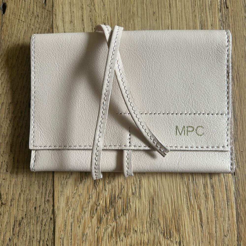 Never used monogramed mark and graham leather charger roll up